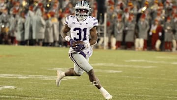 Nov 30, 2024; Ames, Iowa, USA; Kansas State Wildcats running back DJ Giddens (31) runs for a first down against the Iowa State Cyclones in the second quarter at at Jack Trice Stadium. Mandatory Credit: Reese Strickland-Imagn Images