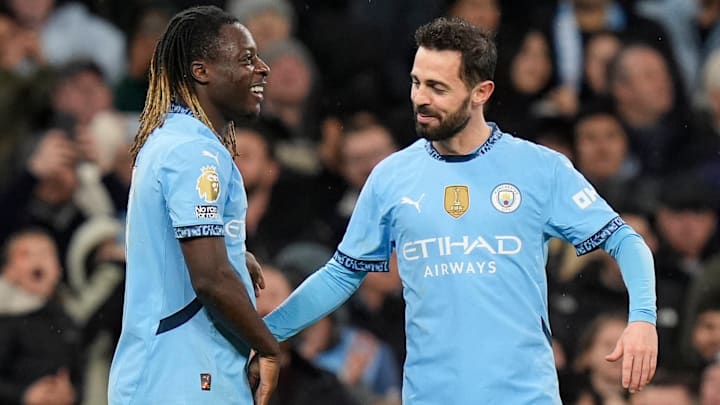 Jeremy Doku (left) and Bernardo Silva (right) should feature again for Manchester City.