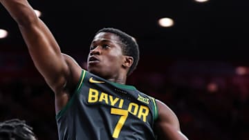 Jan 14, 2025; Tucson, Arizona, USA; Baylor Bears guard VJ Edgecombe (7) attempts to make a lay up while Arizona Wildcats guard Jaden Bradley (0) watches during the first half of the game at McKale Center. Mandatory Credit: Aryanna Frank-Imagn Images