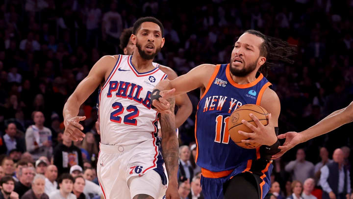 Apr 30, 2024; New York, New York, USA; New York Knicks guard Jalen Brunson (11) drives to the basket against Philadelphia 76ers guards Cameron Payne (22) and Tyrese Maxey (0) during the fourth quarter of game 5 of the first round of the 2024 NBA playoffs at Madison Square Garden. Mandatory Credit: Brad Penner-USA TODAY Sports