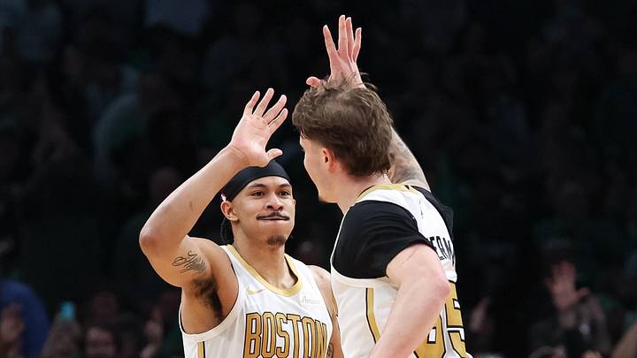 Apr 12, 2026; Boston, Massachusetts, USA; Boston Celtics forward Ron Harper Jr (13) and Boston Celtics guard Baylor Scheierman (55) celebrate during the second half against the Orlando Magic at TD Garden. Mandatory Credit: Paul Rutherford-Imagn Images