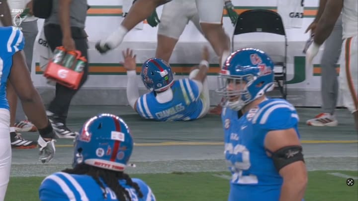Trinidad Chambliss ended up under Miami’s bench after throwing a pass away.