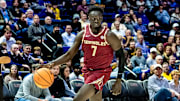 Dec 3, 2024; Baton Rouge, Louisiana, USA;  Florida State Seminoles forward Jerry Deng (7) brings the ball up court against the LSU Tigers during the second half at Pete Maravich Assembly Center. Mandatory Credit: Stephen Lew-Imagn Images