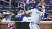 Texas Rangers pinch hitter Rowdy Tellez (44) hits an RBI double in the eighth inning against the New York Mets.
