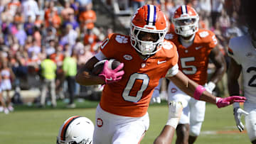 Oct 19, 2024; Clemson, South Carolina, USA; Clemson Tigers wide receiver Antonio Williams (0) runs the ball against the Virginia Cavaliers at Memorial Stadium. Mandatory Credit: Alexander Hicks-Imagn Images