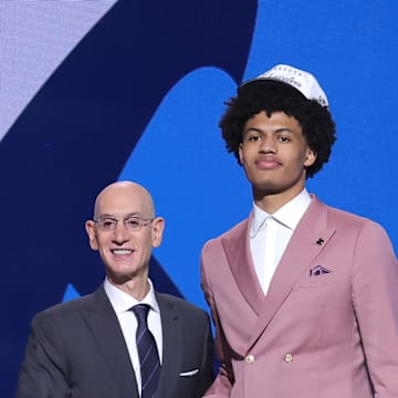 Jun 25, 2025; Brooklyn, NY, USA;  Joan Beringer stands with NBA commissioner Adam Silver after being selected as the 17th pick by the Minnesota Timberwolves in the first round of the 2025 NBA Draft at Barclays Center. Mandatory Credit: Brad Penner-Imagn Images