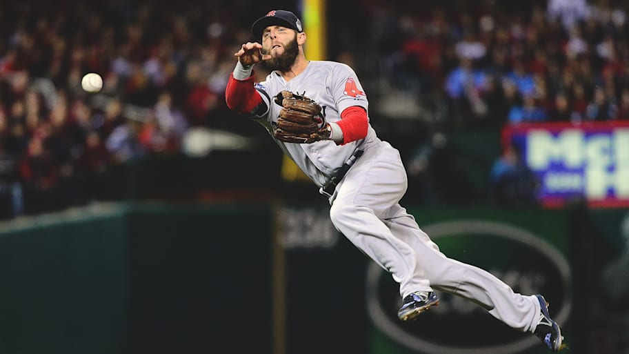 Red Sox second baseman Dustin Pedroia makes an acrobatic throw