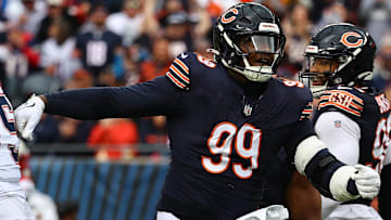 Nov 10, 2024; Chicago, Illinois, USA; Chicago Bears defensive tackle Gervon Dexter Sr. (99) reacts against the New England Patriots during the first quarter at Soldier Field.