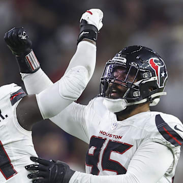 Sep 15, 2024; Houston, Texas, USA; Houston Texans defensive end Derek Barnett (95) celebrates with defensive end Will Anderson Jr. (51) after a sack during the second quarter against the Chicago Bears at NRG Stadium. Mandatory Credit: Troy Taormina-Imagn Images