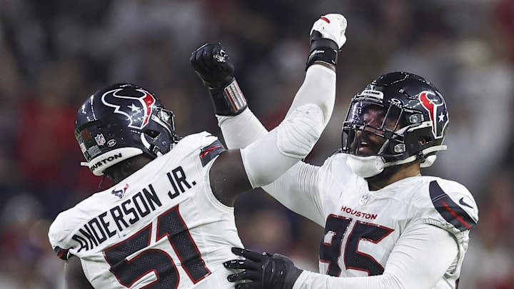 Sep 15, 2024; Houston, Texas, USA; Houston Texans defensive end Derek Barnett (95) celebrates with defensive end Will Anderson Jr. (51) after a sack during the second quarter against the Chicago Bears at NRG Stadium. Mandatory Credit: Troy Taormina-Imagn Images