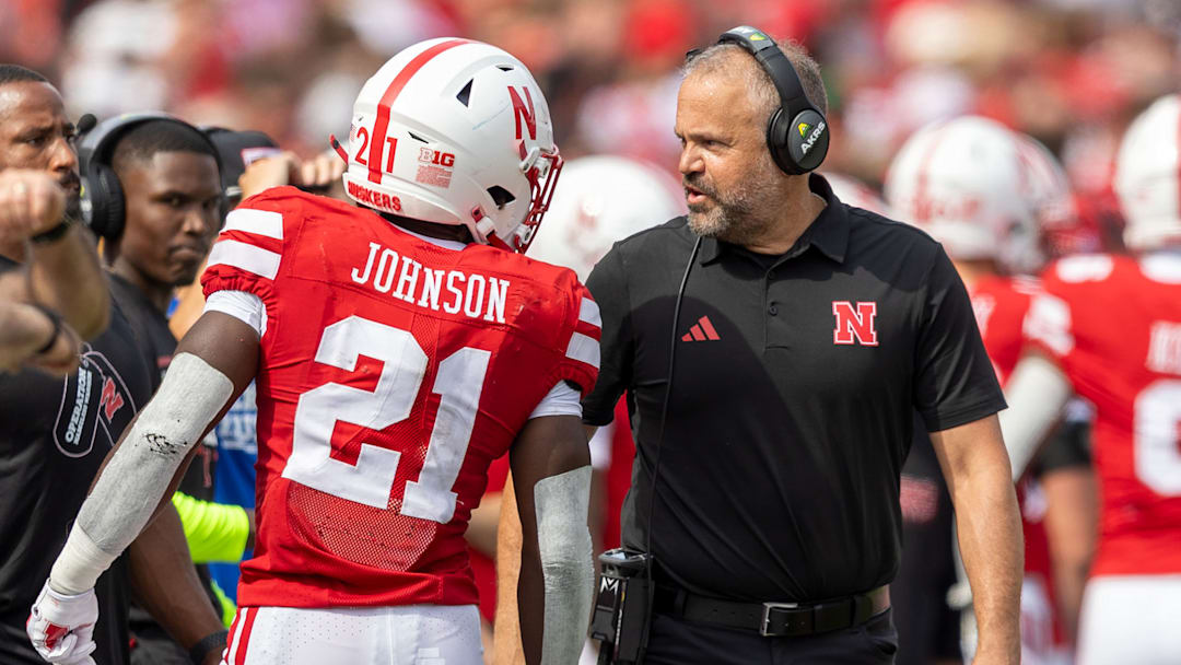 Nebraska running back Emmett Johnson and coach Matt Rhule converse during the Michigan game.