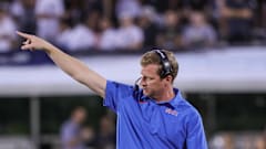 Mustangs coach Rhett Lashlee points to field