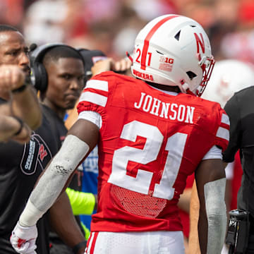 Nebraska running back Emmett Johnson and coach Matt Rhule converse during the Michigan game.