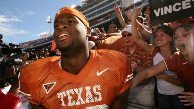 2003-2005: UT quarterback Vince Young celebrates wth the fans after beating OU 45-12 at the Red River Rivalry at the Cotton B