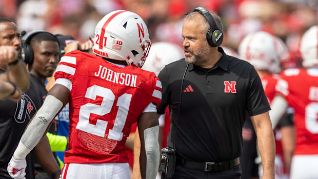 Nebraska running back Emmett Johnson and coach Matt Rhule talk during the Michigan game.