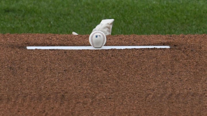 A detailed view of the game ball on the pitcher's mound.
