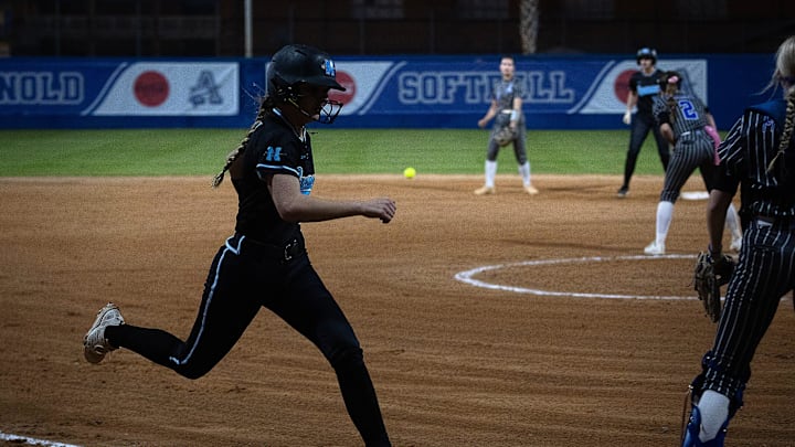 North Bay Havens’ Ally Brady crosses the plate on Kaylee Goodpaster’s double against Arnold in Panama City Beach, Fla., March 11, 2025. North Bay Haven won the game 8-1. (Tyler Orsburn/News Herald)