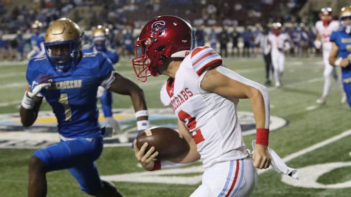 Mainland's Dennis King III (1) angles for a tackle against Seabreeze's Dylan Tocci (2) in game earlier this season. On Nov. 21, King intercepted a pass with less than 2 minutes left to secure the Buccaneers’ 36-31 victory against Lynn Haven Mosley in a Class 5A, Region 1 semifinal game.