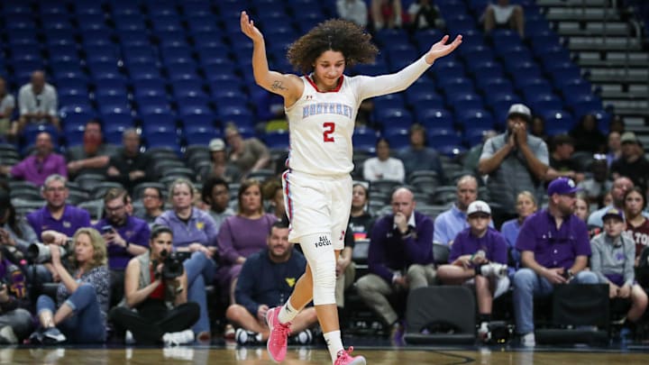 Monterey's Aaliyah Chavez waves on the crowd after being substituted out before the final minutes of the Class 5A Division II state championship girls basketball game on Saturday, March 1, 2025, at the Alamodome in San Antonio.
