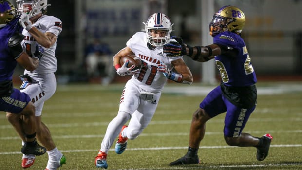 Miller's LaMarcus Cullum corrals Veterans Memorial's Larry Moya on Oct. 19, 2023 in Corpus Christi, Texas.