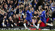Chelsea's Ricardo Carvalho (R) runs to c