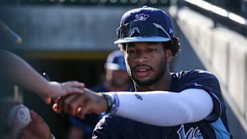 Hooks' Brice Matthews signs baseballs for fans before the game against the Amarillo Sod Poodles at Whataburger Field on Thursday, August 1, 2024, in Corpus Christi, Texas.