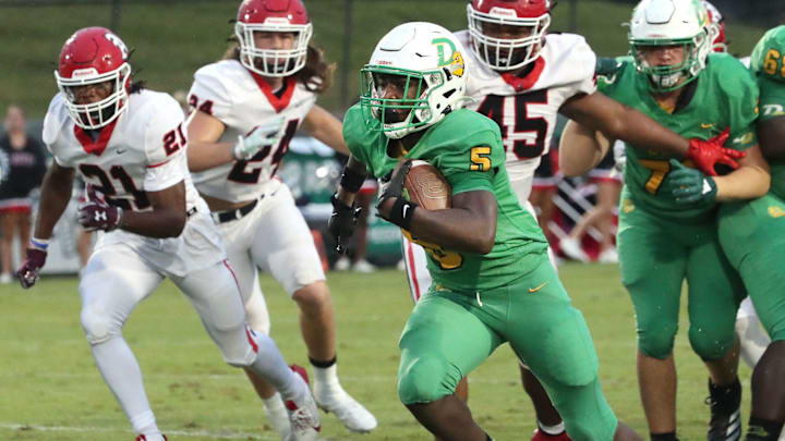 DeLand's Taihj Moore (5) breaks through the Appling County line for a long touchdown run, Friday, Sept. 13, 2024 at Spec Martin Stadium.