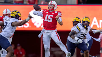 Nebraska quarterback Dylan Raiola makes a throw on the run against Michigan.