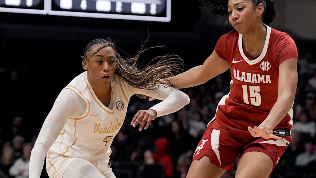 Vanderbilt guard Mikayla Blakes (1) drives to the basket against Alabama guard Ta'mia Scott (15) during the first half of an NCAA college basketball game at Memorial Gymnasium Thursday, Feb. 26, 2026, in Nashville, Tenn.