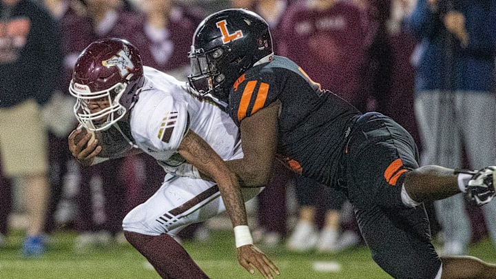 Niceville (15) Johnny Lewis jr is tackled by Lakeland (0) Malik Morris Friday December 6 , 2024 in Lakeland Fl.
Ernst Peters/The Ledger