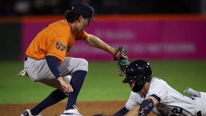 RockHounds shortstop Jacob Wilson misses the ball as Hooks runner Chad Stevens slides onto second on Opening Night at Whataburger Field on Friday, April 5, 2024, in Corpus Christi, Texas.