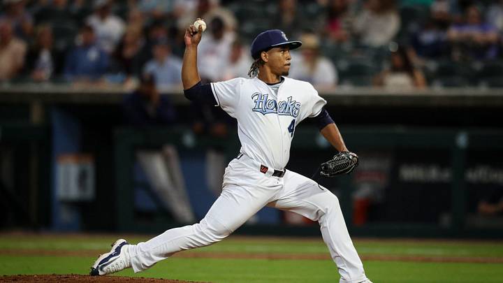 Hooks pitcher Miguel Ullola throws a pitch on Opening Night at Whataburger Field on Friday, April 5, 2024, in Corpus Christi, Texas.
