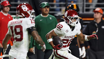 Oklahoma Sooners defensive back Peyton Bowen (22) runs an interception back against the Tennessee Volunteers during the second quarter at Neyland Stadium. 