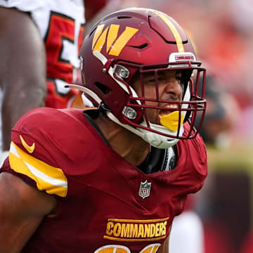 Sep 8, 2024; Tampa, Florida, USA; Washington Commanders running back Austin Ekeler (30) reacts after a run against the Tampa Bay Buccaneers in the second quarter at Raymond James Stadium. Mandatory Credit: Nathan Ray Seebeck-Imagn Images