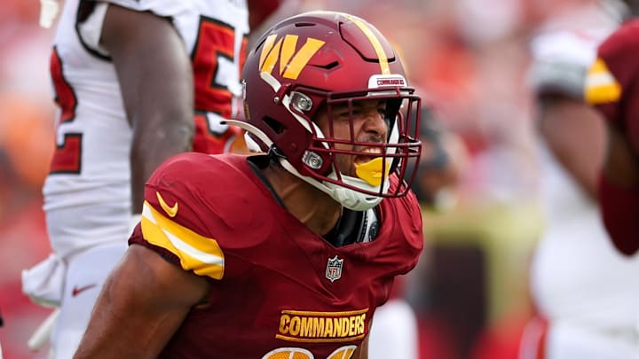 Sep 8, 2024; Tampa, Florida, USA; Washington Commanders running back Austin Ekeler (30) reacts after a run against the Tampa Bay Buccaneers in the second quarter at Raymond James Stadium. Mandatory Credit: Nathan Ray Seebeck-Imagn Images