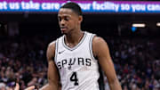Mar 7, 2025; Sacramento, California, USA; San Antonio Spurs guard De'Aaron Fox (4) high fives team mates after coming out of the game during the fourth quarter at Golden 1 Center.