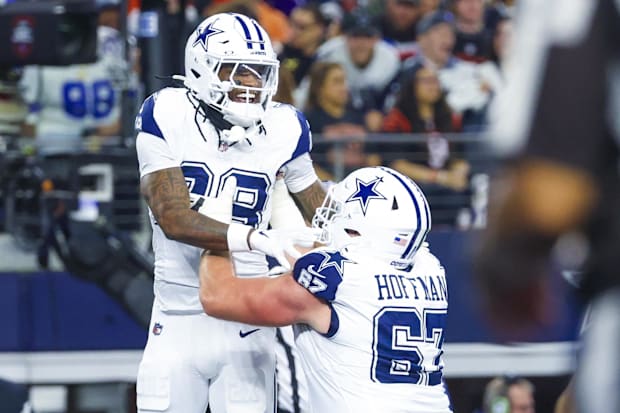 Dallas Cowboys wide receiver CeeDee Lamb celebrates with Dallas Cowboys center Brock Hoffman