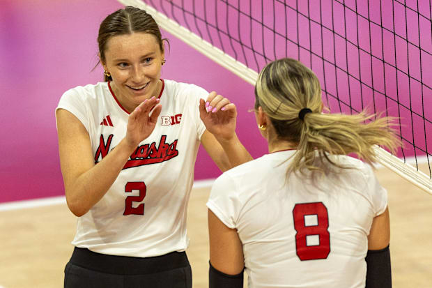 Nebraska setter Bergen Reilly celebrates with middle blocker Kenna Cogill during the Red-White Scrimmage on Saturday.