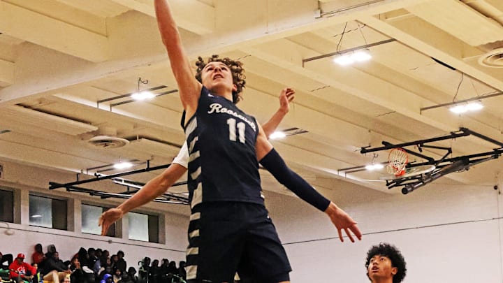 Roosevelt freshman Charlie King (11) scores two points as the Roosevelt Roughriders compete against the Hoover Huskies in high school boys    basketball on Friday, January 5, 2024, at Hoover High School.