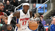 Apr 4, 2025; Toronto, Ontario, CAN;  Detroit Pistons guard Dennis Schroder (17) dribbles the ball past Toronto Raptors guard Jamal Shead (23) in the first half at Scotiabank Arena. Mandatory Credit: Dan Hamilton-Imagn Images