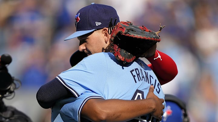 Toronto Blue Jays first baseman Vladimir Guerrero Jr. (27) embraces starting pitcher Bowden Francis (44) after a win over the Los Angeles Angels at Rogers Centre on Aug 24.