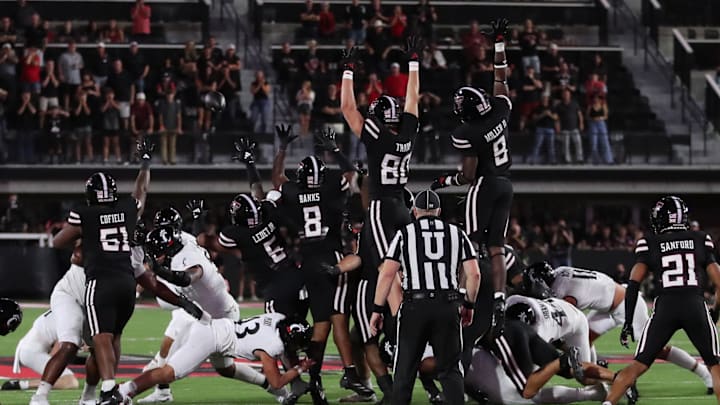 Sep 28, 2024; Lubbock, Texas, USA;  The Texas Tech Red Raiders defensive attempt to block a field goal in the second half in the game against the Cincinnati Bearcats at Jones AT&T Stadium and Cody Campbell Field. Mandatory Credit: Michael C. Johnson-Imagn Images