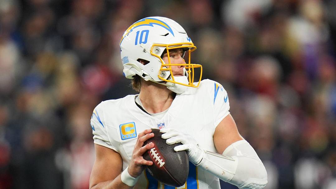 Justin Herbert drops back to pass. Justin Herbert drops back to pass.