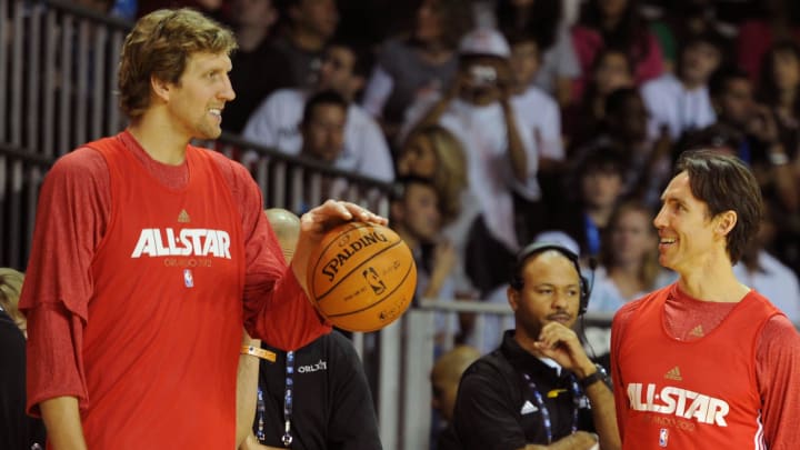 Feb 25, 2012; Orlando, FL, USA; Western Conference forward Dirk Nowitzki of the Dallas Mavericks (left), Steve Nash of the Phoenix Suns (right) chat during the 2012 NBA All-Star team practice session at the Orange County Convention Center. Mandatory Credit: Bob Donnan-USA TODAY Sports