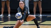 Purdue sophomore Ryan McAleer (3) digs a ball during an NCAA volleyball match