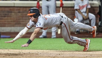 Aug 20, 2024; New York City, New York, USA;  Baltimore Orioles first baseman Ryan Mountcastle (6) slides into home plate in the ninth inning against the New York Mets at Citi Field. Mandatory Credit: Wendell Cruz-USA TODAY Sports