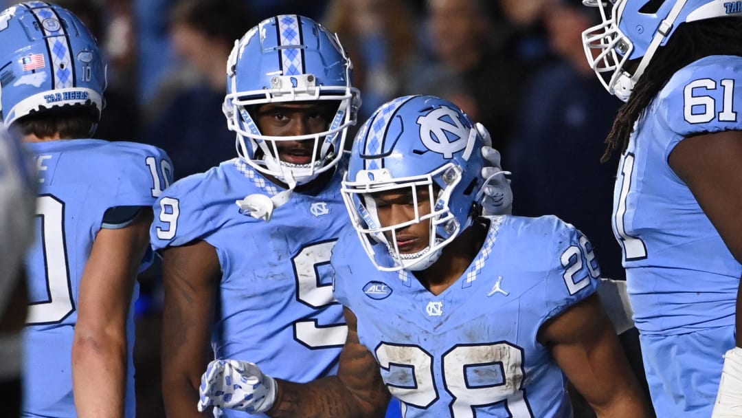 Nov 11, 2023; Chapel Hill, North Carolina, USA; North Carolina Tar Heels running back Omarion Hampton (28) with wide receiver Devontez Walker (9) after scoring a touchdown in the fourth quarter at Kenan Memorial Stadium. Mandatory Credit: Bob Donnan-USA TODAY Sports