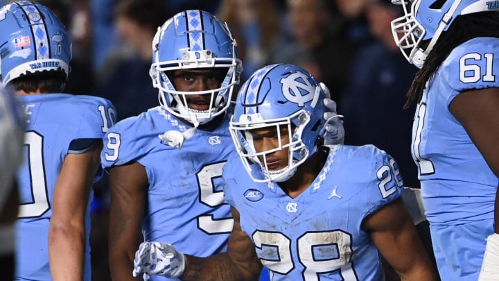 Nov 11, 2023; Chapel Hill, North Carolina, USA; North Carolina Tar Heels running back Omarion Hampton (28) with wide receiver Devontez Walker (9) after scoring a touchdown in the fourth quarter at Kenan Memorial Stadium. Mandatory Credit: Bob Donnan-USA TODAY Sports