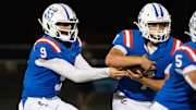 Churchill running back Lukas Babbitt, right, carries the ball off a handoff from Churchill quarterback Lucas Gansen as the Churchill Lancers host the Marist Catholic Spartans on Aug. 29, 2025, at Churchill High School in Eugene, Oregon.