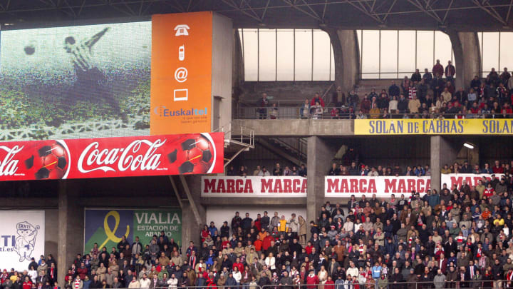 Athletic Bilbao supporters observe a min